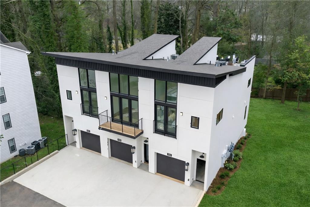 1165 Penny Lane Atlanta, GA 30329 - Photo 35 of 40 a view of a white house with a sink and backyard