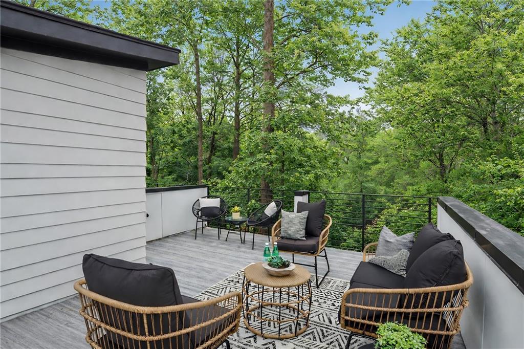 1165 Penny Lane Atlanta, GA 30329 - Photo 10 of 40 a view of patio with couches table and chairs and potted plants