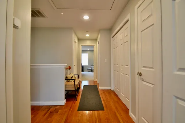 a living room with furniture and a chair