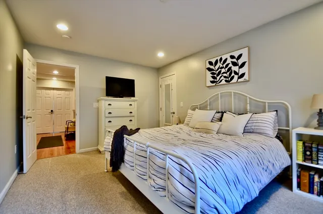 a bedroom with furniture and window