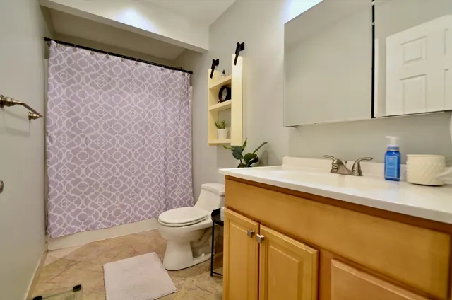 a view of a house with backyard and porch