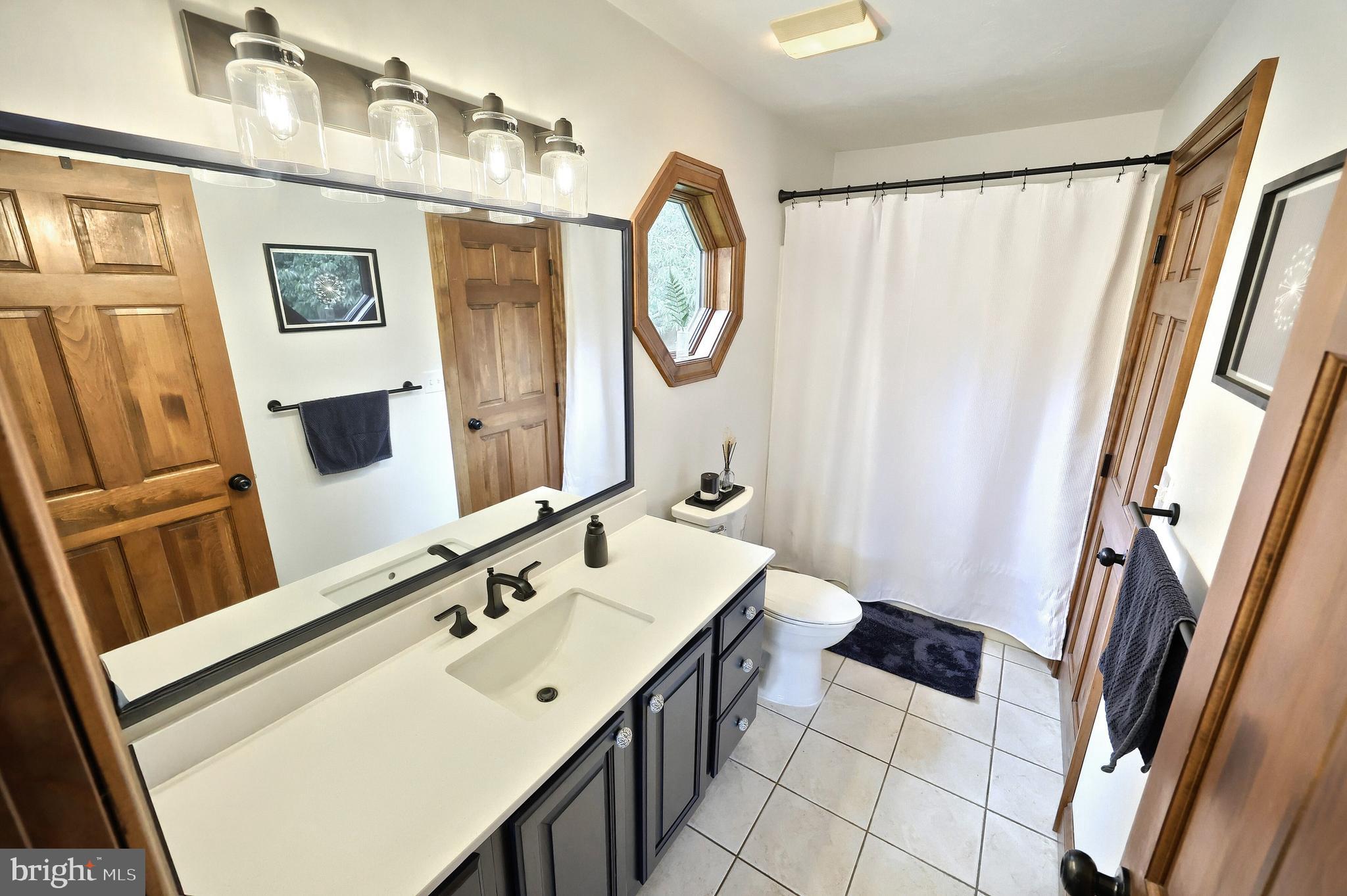 312 Knox Road Gettysburg, PA 17325 - Photo 33 of 50 a bathroom with a double vanity sink and a mirror