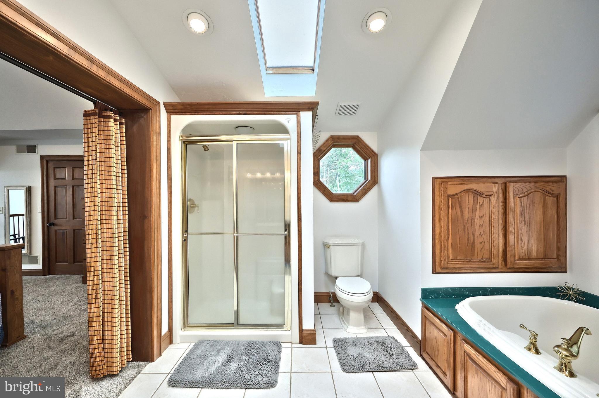 312 Knox Road Gettysburg, PA 17325 - Photo 40 of 50 a bathroom with a granite countertop tub shower and mirror