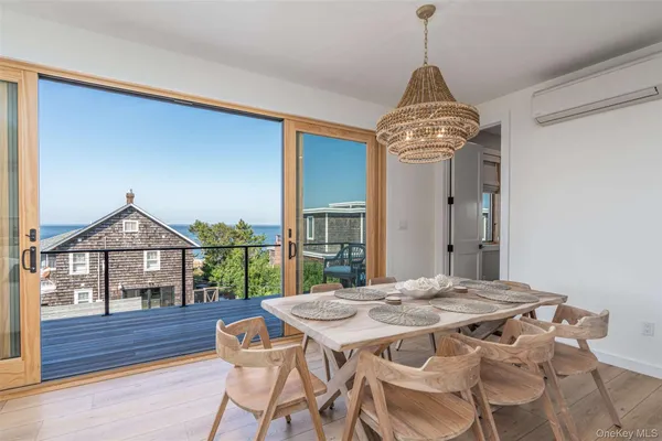 a view of a dining room with furniture window and outside view