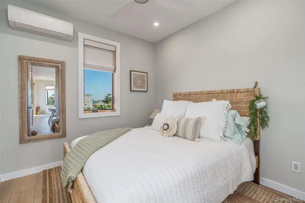 a bedroom with bed and window