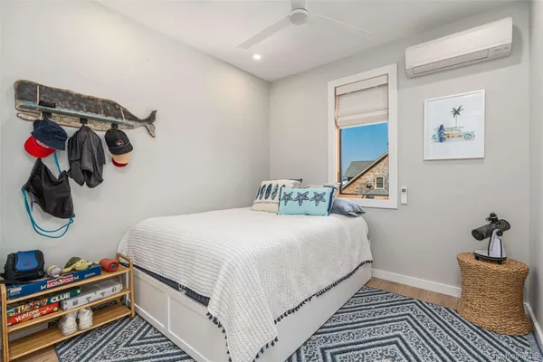 a bedroom with a bed and cabinets