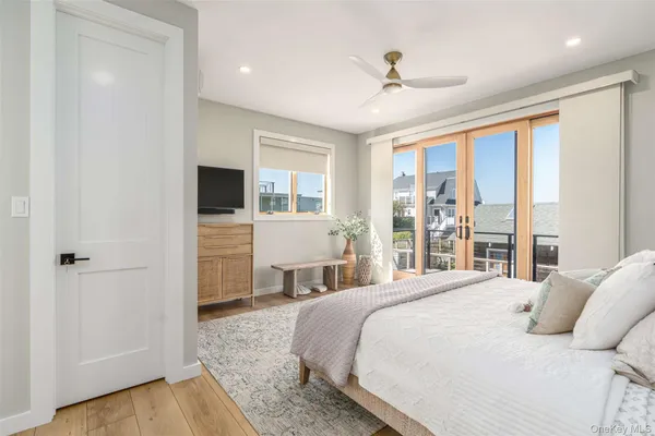 a bedroom with a bed and a television