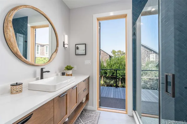 a bathroom with a double vanity sink and a mirror