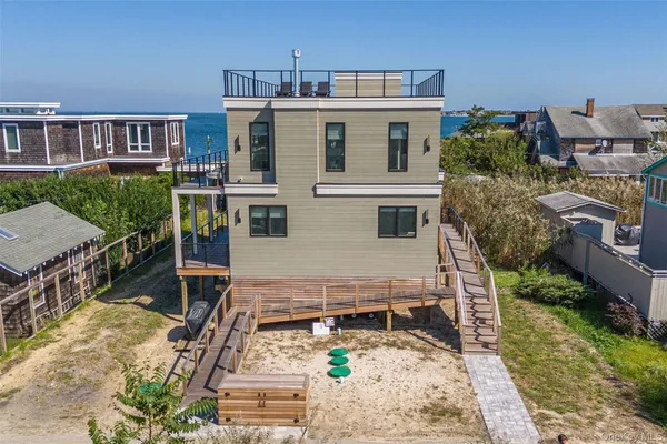 a view of a house with roof deck