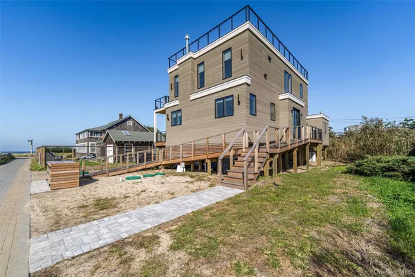 a view of a patio with table and chairs