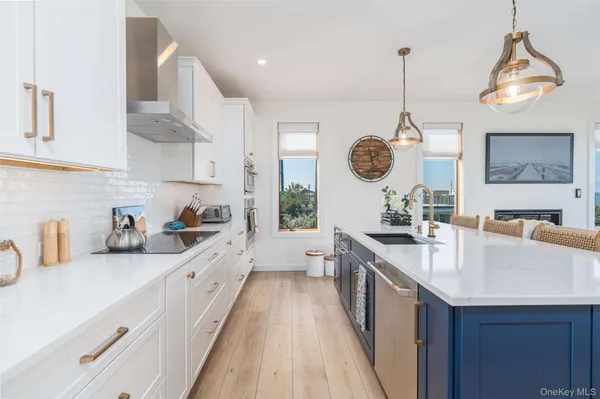a kitchen with a sink cabinets and window