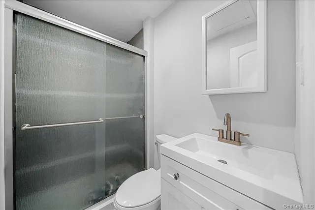 a spacious bedroom with a large bed and a couch