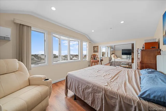 a bed room with a bed and a large window