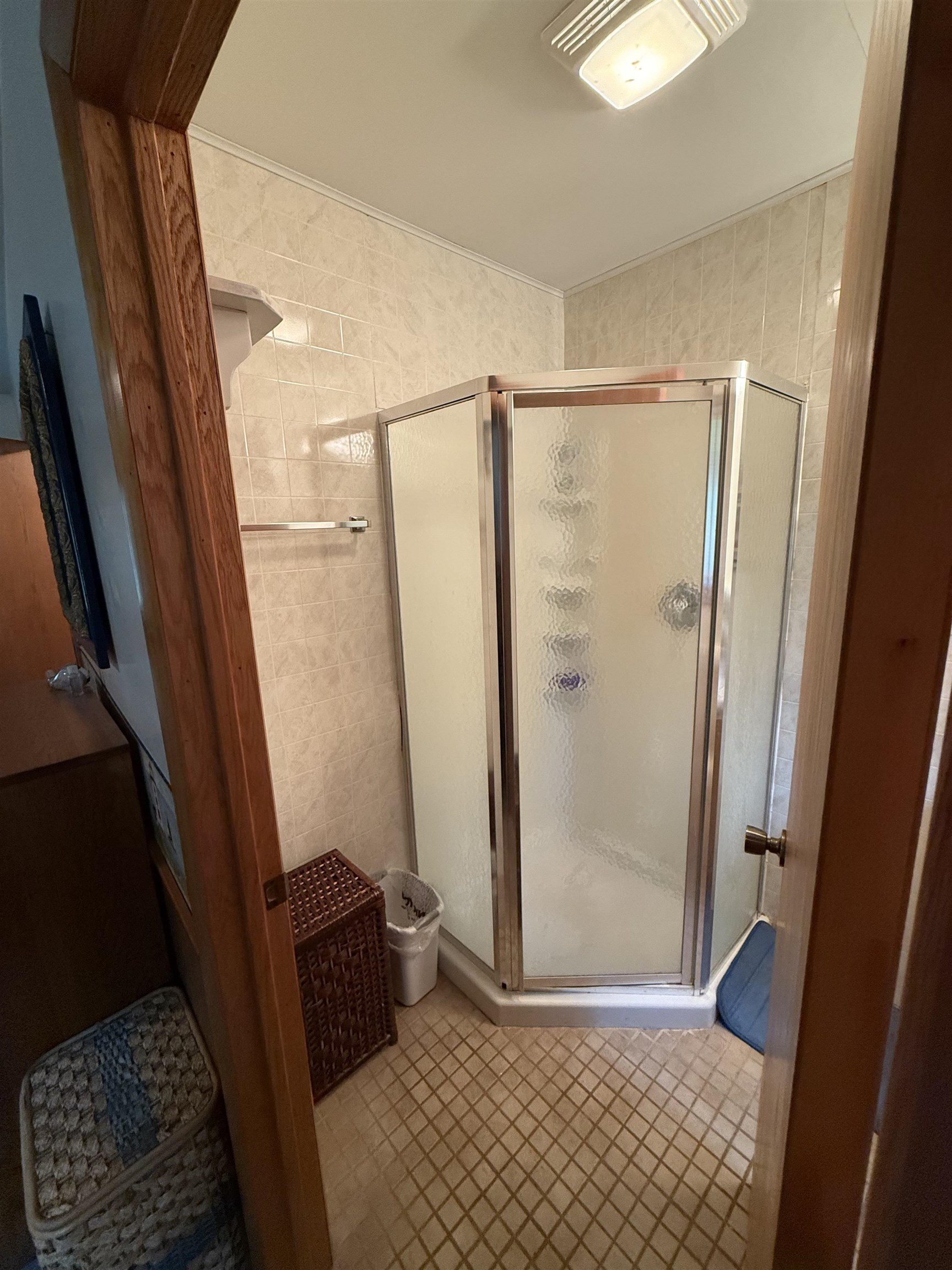 63380 Trout Lake Road Iron River, WI 54847 - Photo 20 of 36 Full bath featuring a stall shower and tile patterned flooring
