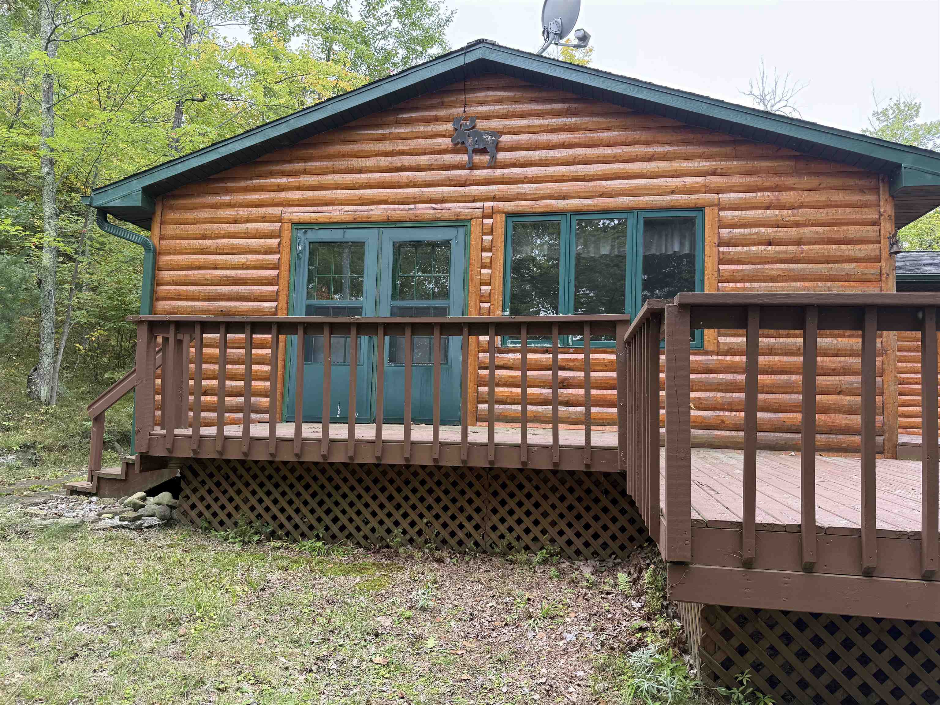 63380 Trout Lake Road Iron River, WI 54847 - Photo 2 of 36 Rear view of house featuring a deck and log veneer siding