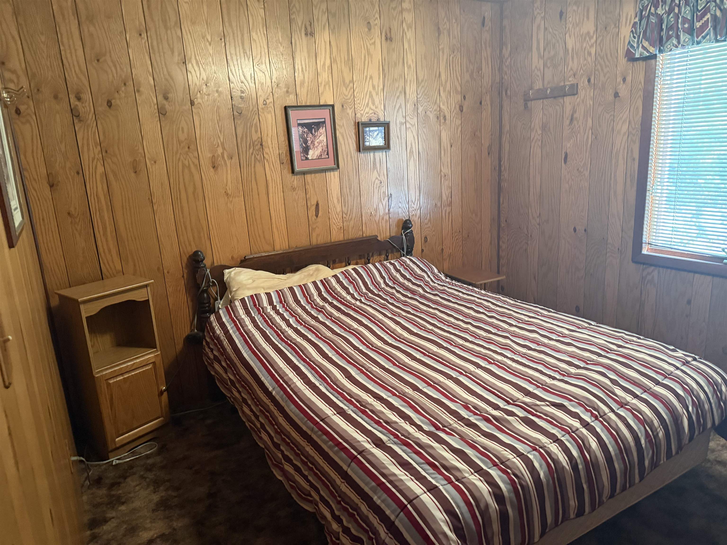 63380 Trout Lake Road Iron River, WI 54847 - Photo 24 of 36 Bedroom with wood walls