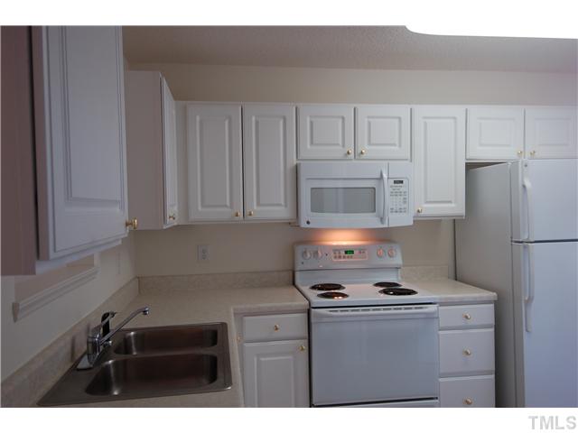 2510 Huntscroft Lane, Unit 203 Raleigh, NC 27617 - Photo 5 of 12 a kitchen with appliances a sink and cabinets