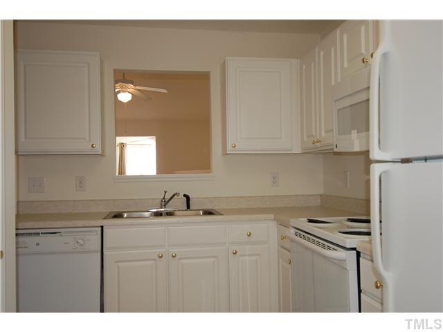 2510 Huntscroft Lane, Unit 203 Raleigh, NC 27617 - Photo 6 of 12 a kitchen with stainless steel appliances granite countertop a sink and cabinets