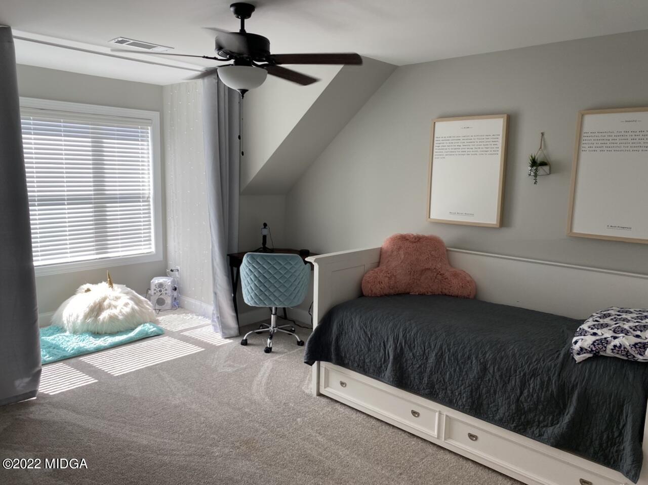 101 Carters Way Forsyth, GA 31029 - Photo 24 of 28 a bedroom with a bed and a window