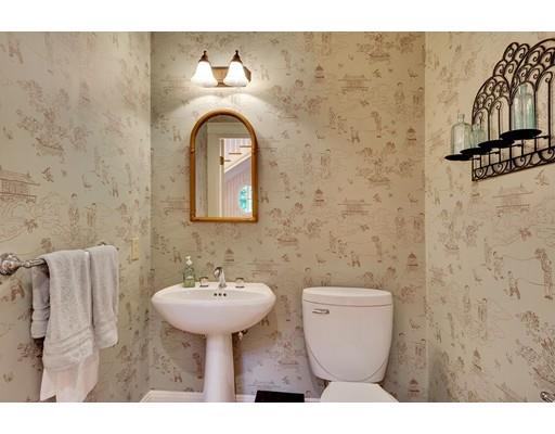 29 McCall Road Winchester, MA 01890 - Photo 23 of 42 a bathroom with a toilet sink and mirror