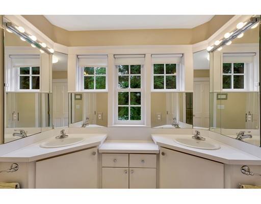29 McCall Road Winchester, MA 01890 - Photo 36 of 42 a bathroom with a sink and a large mirror