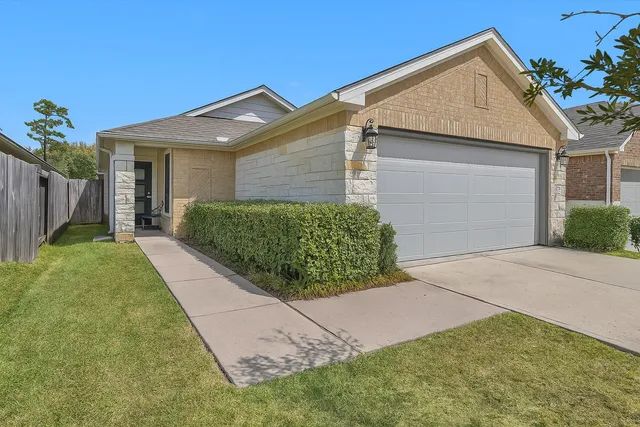 a front view of a house with garden