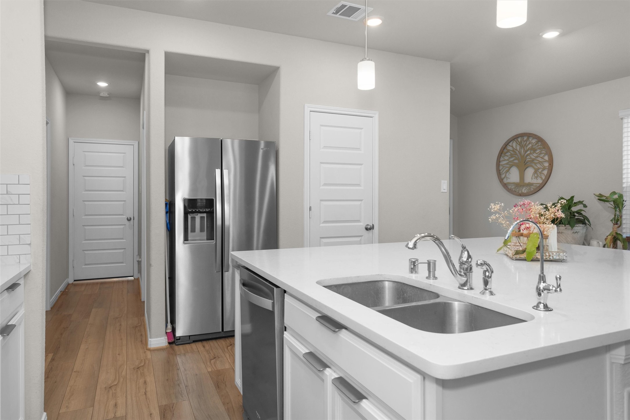 18544 Meadow Point Lane Montgomery, TX 77316 - Photo 15 of 35 a kitchen with a sink and a refrigerator