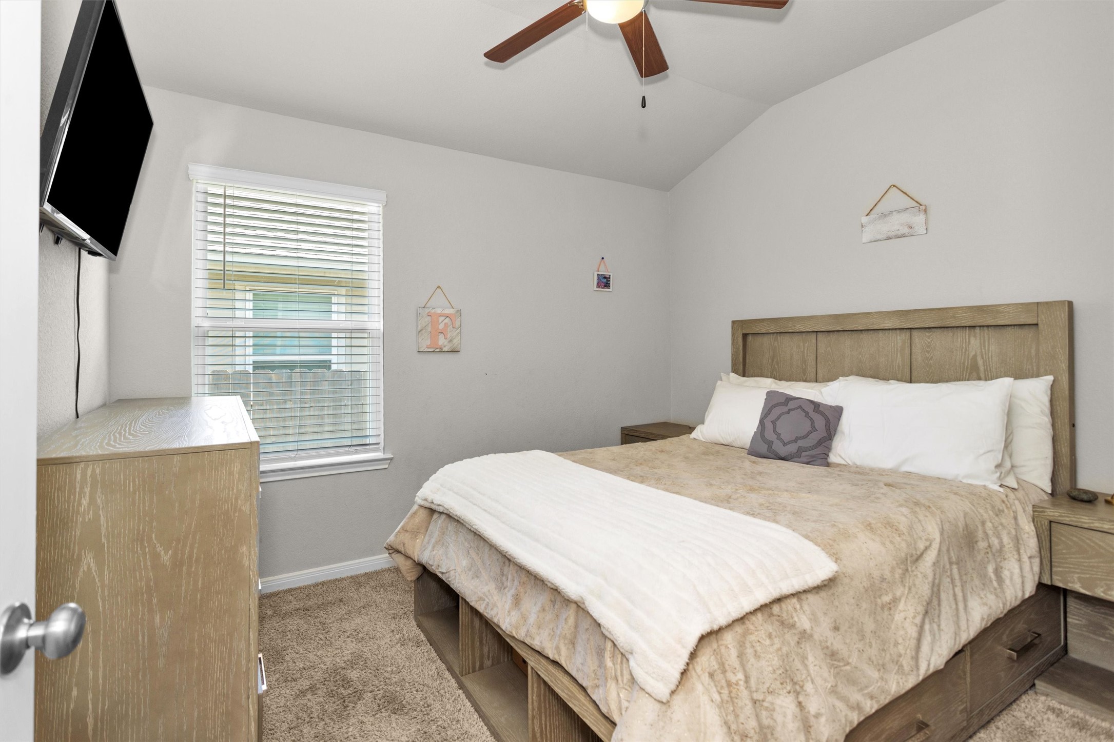 18544 Meadow Point Lane Montgomery, TX 77316 - Photo 21 of 35 a bedroom with a bed and a flat tv screen