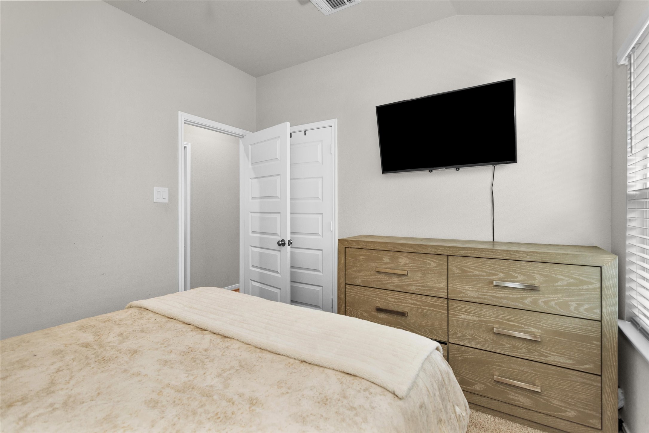18544 Meadow Point Lane Montgomery, TX 77316 - Photo 22 of 35 a bedroom with a bed and a flat screen tv