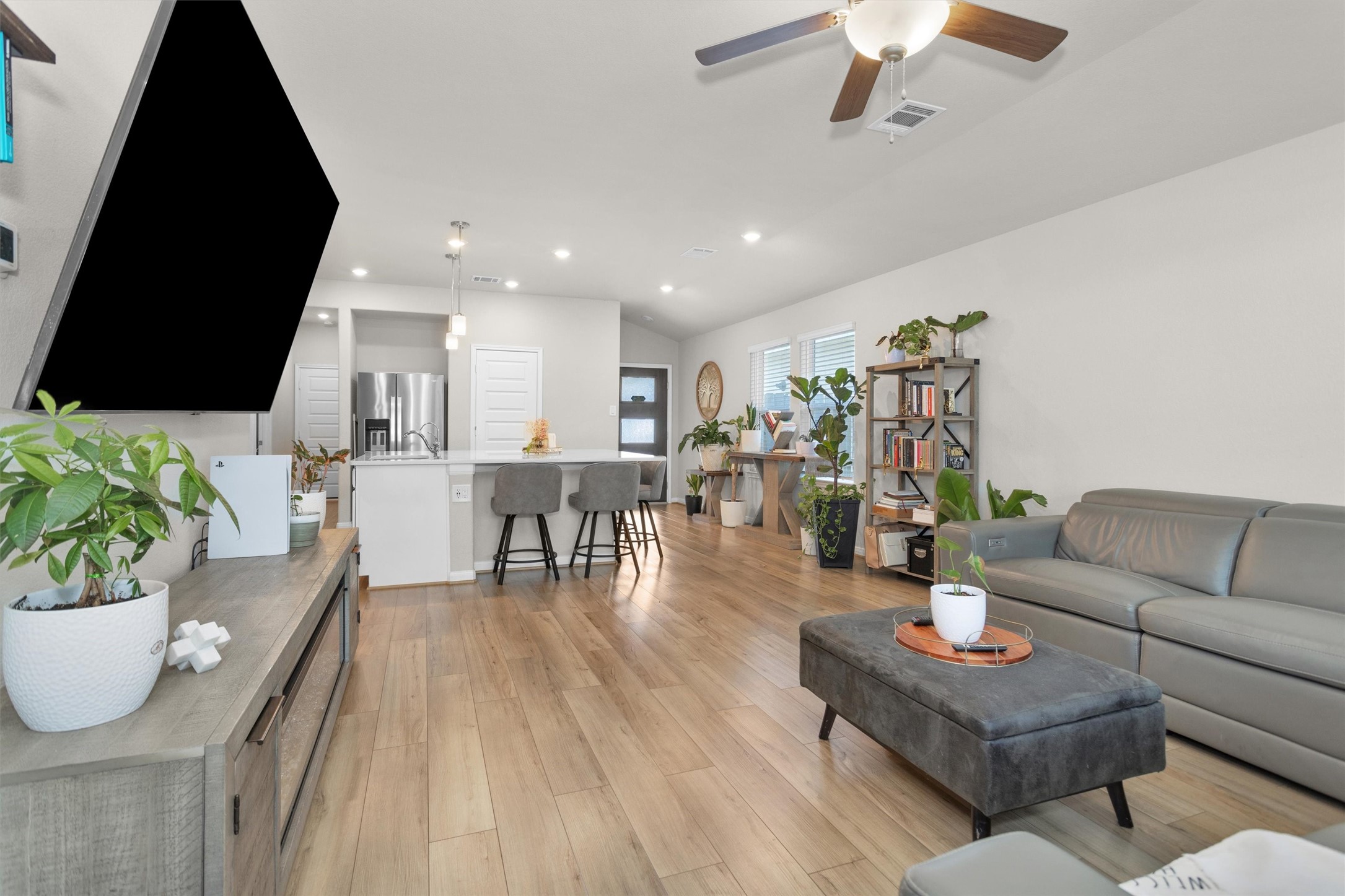 18544 Meadow Point Lane Montgomery, TX 77316 - Photo 8 of 35 a living room with furniture and a flat screen tv