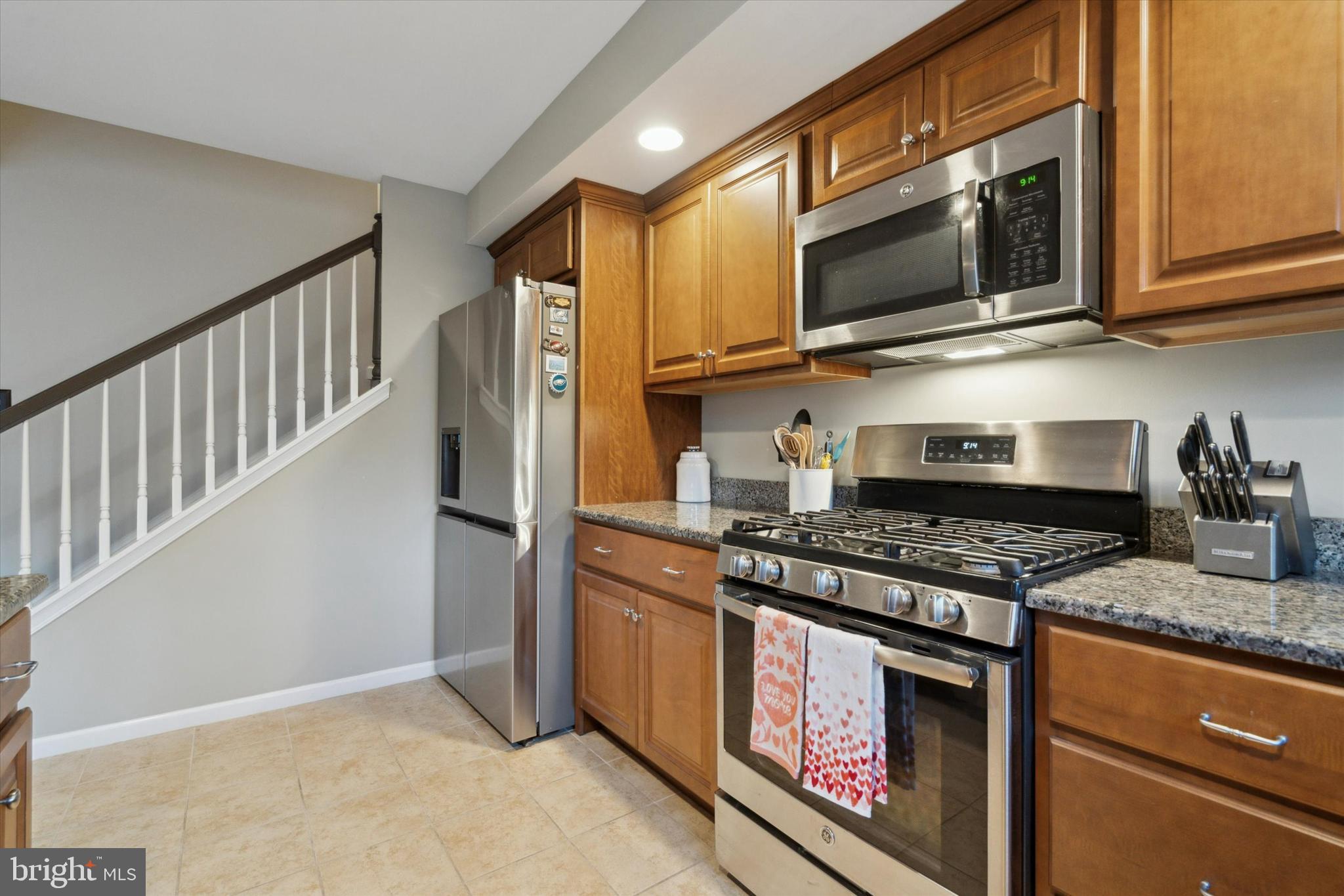 400 North York Road, Unit B Hatboro, PA 19040 - Photo 11 of 29 a kitchen with stainless steel appliances granite countertop a stove a refrigerator and a microwave