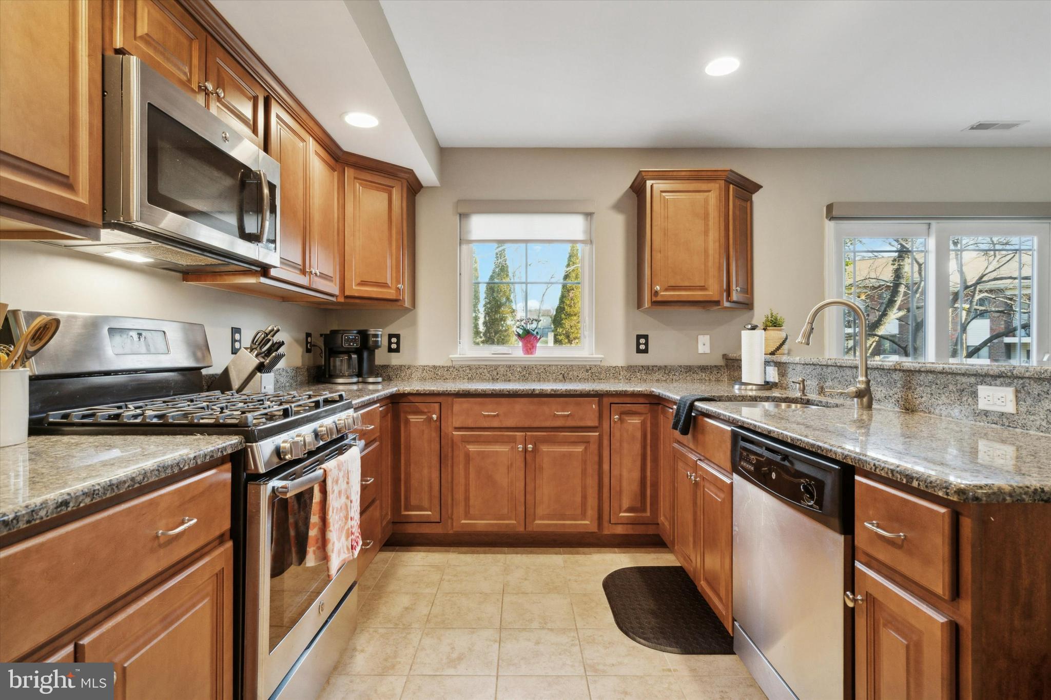 400 North York Road, Unit B Hatboro, PA 19040 - Photo 9 of 29 a kitchen with stainless steel appliances granite countertop a sink a stove and a microwave