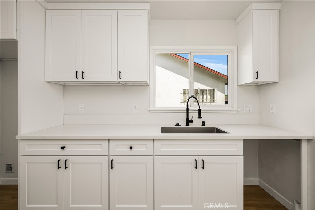 1013 West 138th Street Compton, CA 90222 - Photo 13 of 30 a kitchen with appliances cabinets and a sink