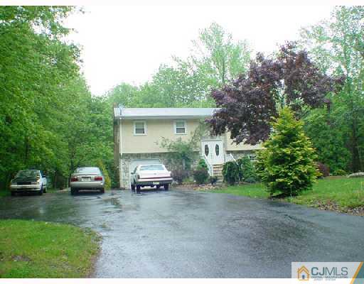 453 Cottrell Road Old Bridge, NJ 08857 - Photo 1 of 1 a front view of a house with car parked