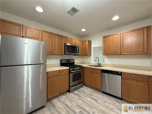 an empty room with a empty space and windows