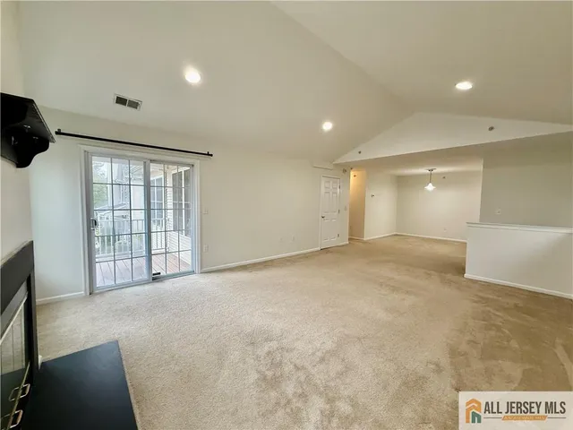a view of a livingroom with furniture and window