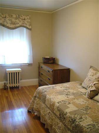 28 Pickwick Road Marblehead, MA 01945 - Photo 12 of 19 a bedroom with a bed and wooden floor