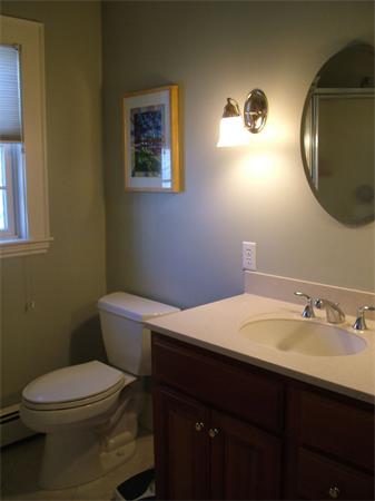 28 Pickwick Road Marblehead, MA 01945 - Photo 18 of 19 a bathroom with a sink a toilet and mirror