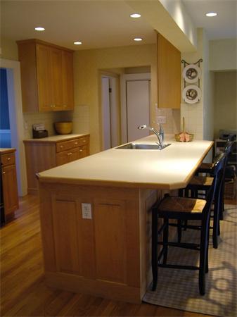 28 Pickwick Road Marblehead, MA 01945 - Photo 8 of 19 a kitchen with kitchen island a sink table and chairs