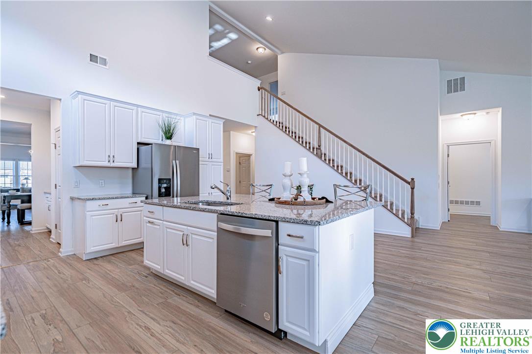 3855 Victors Way Easton, PA 18045 - Photo 14 of 47 a kitchen with appliances a sink and cabinets