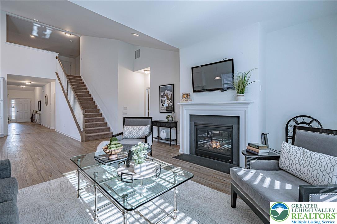 3855 Victors Way Easton, PA 18045 - Photo 23 of 47 a living room with furniture and a fireplace