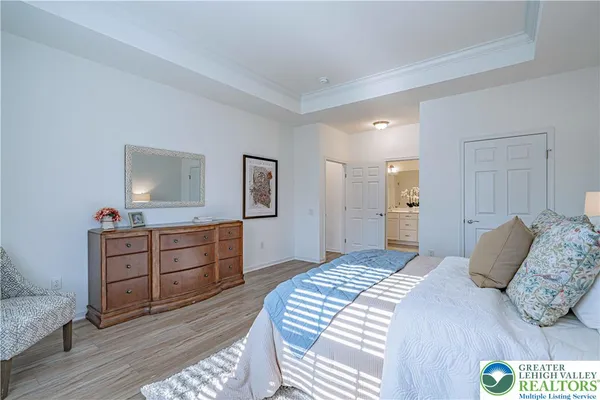 a bedroom with a bed and a dresser