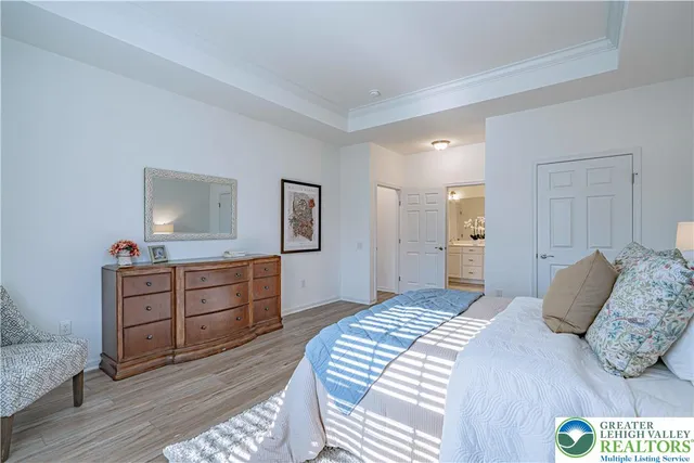 a bedroom with a bed and a dresser