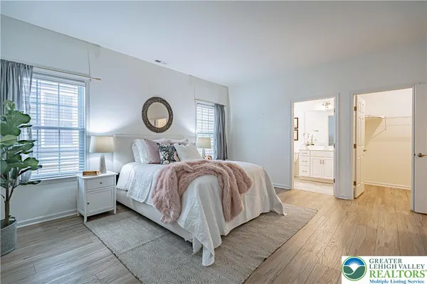 a bed room with a bed and a lamp