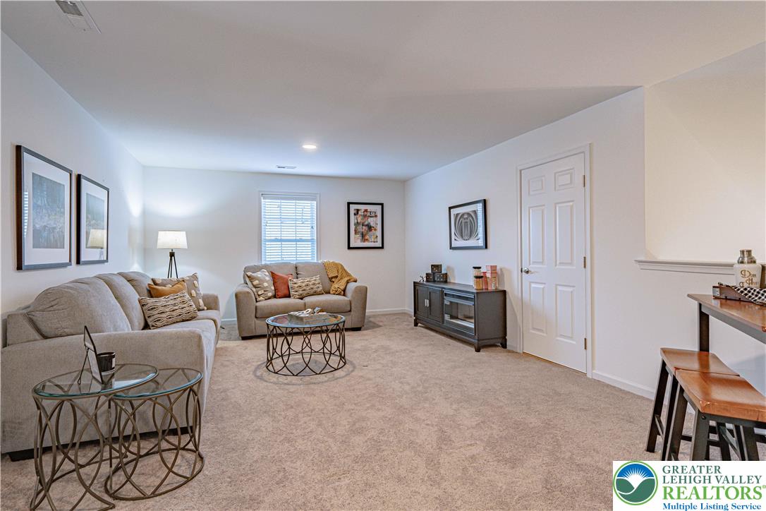 3855 Victors Way Easton, PA 18045 - Photo 37 of 47 a living room with furniture and a flat screen tv