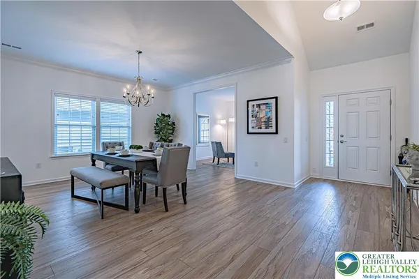 a view of a dining room with furniture window and wooden floor