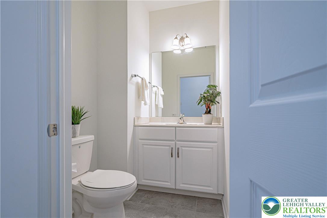 3855 Victors Way Easton, PA 18045 - Photo 8 of 47 a bathroom with a sink a toilet and a mirror