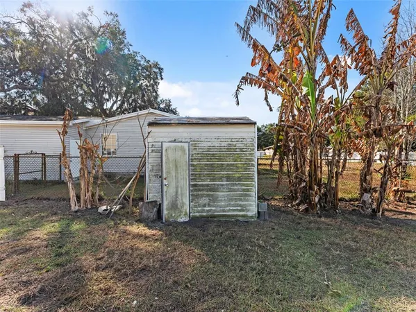 a house view with a big yard