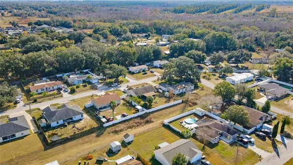 an aerial view of a residential apartment building with a yard