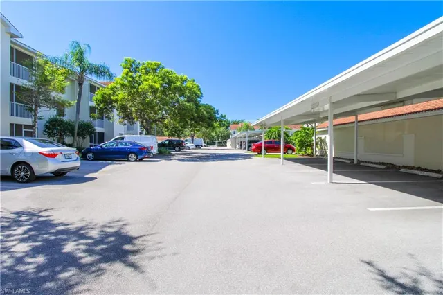 a view of a lake with houses in the background